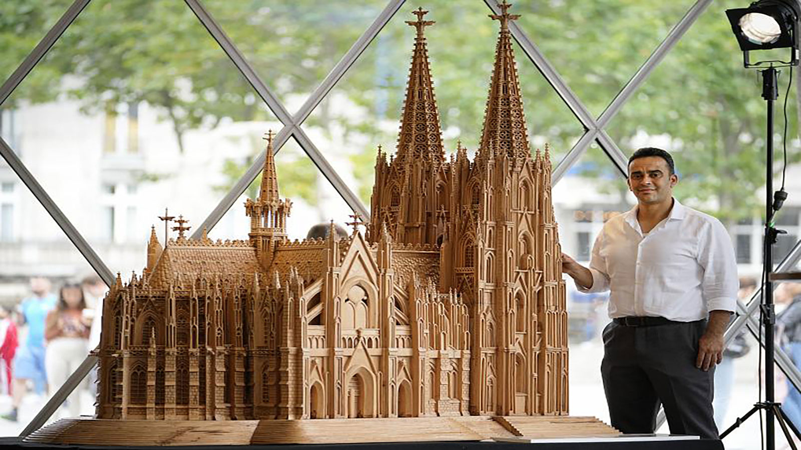 A Syrian refugee makes a wooden copy of the famous Cologne Cathedral .. Video